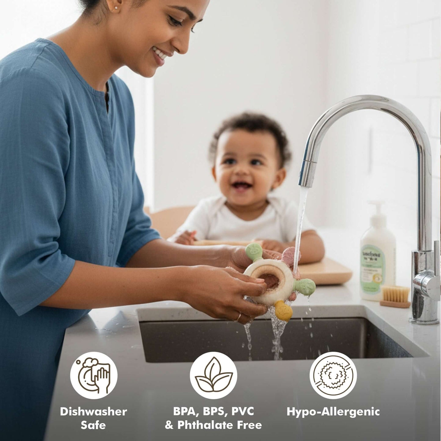 Mom washing a Silicone Wooden Baby Teether | BPA-Free Infant Teething Toy (3+ Months) in the sink.